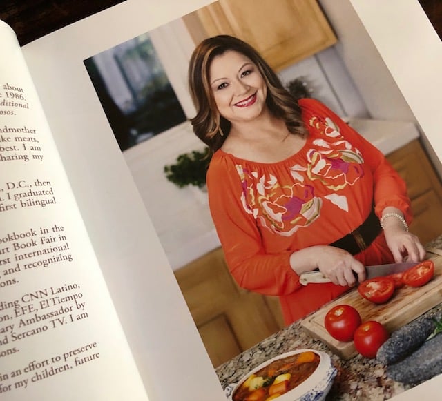 Photo of ALicia Maher in her cookbook.