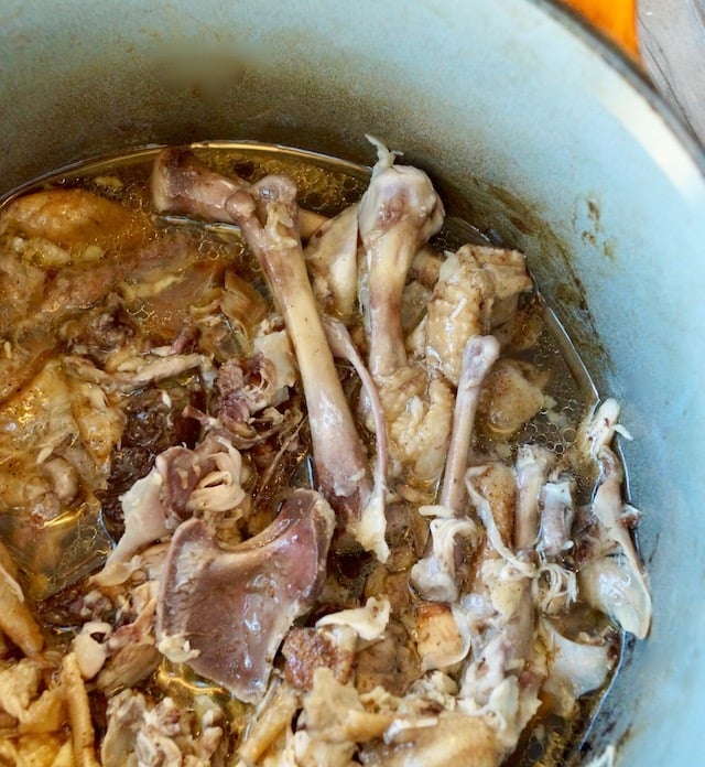 Chicken bones in chicken grease in Dutch Oven.