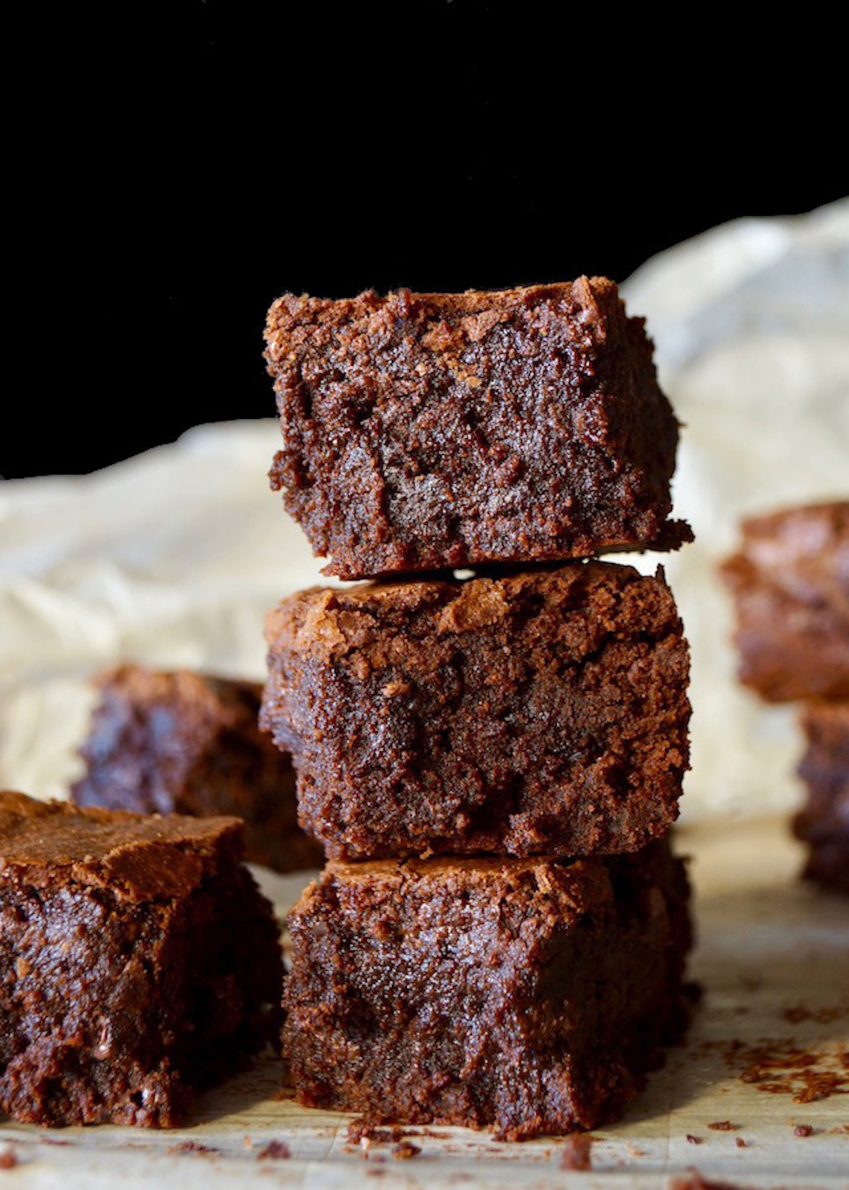 3 stacked Gluten-Free Coconut Flour Brownies with title at the top.