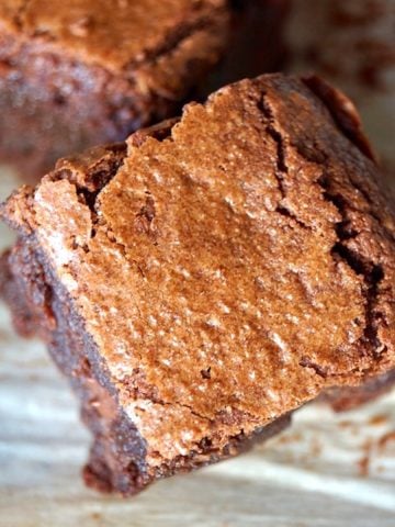 2 Gluten-Free Coconut Flour Brownies on parchment paper
