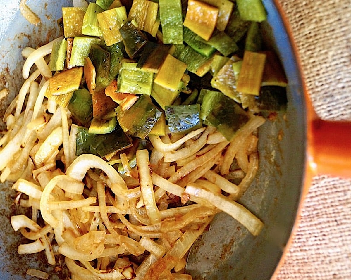 Mexican-Chicken-Poblano-Pasta-Recipe Roasted chopped poblano peppers and onions in a saute pan,