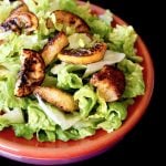 Fried Lemon Caesar Salad on a red plate.
