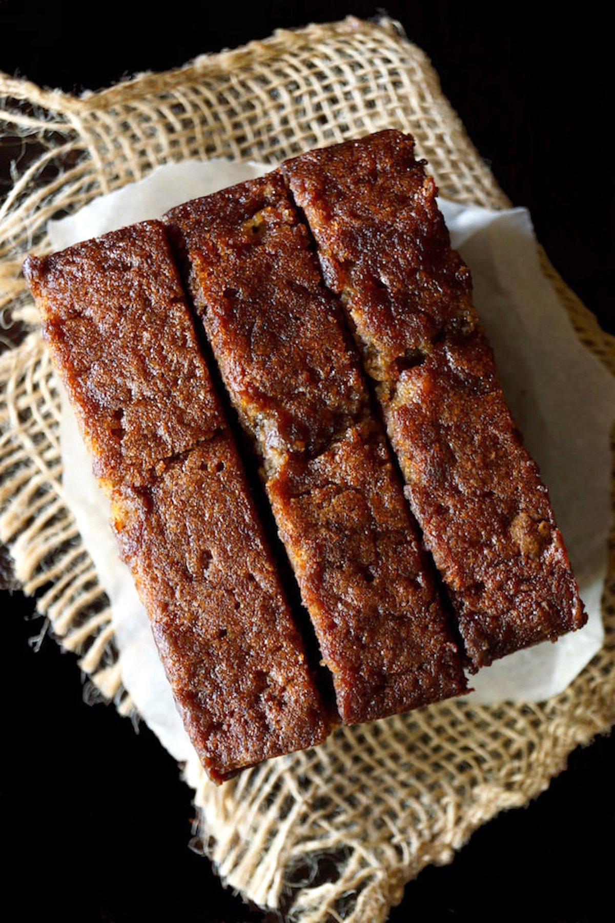 Top view of 3 slices of banana cake with chocolate chips.