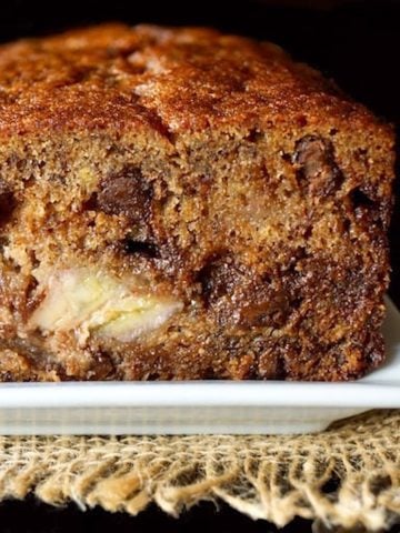 Close up, cross section of a loaf of banana cake with chocolate chips.