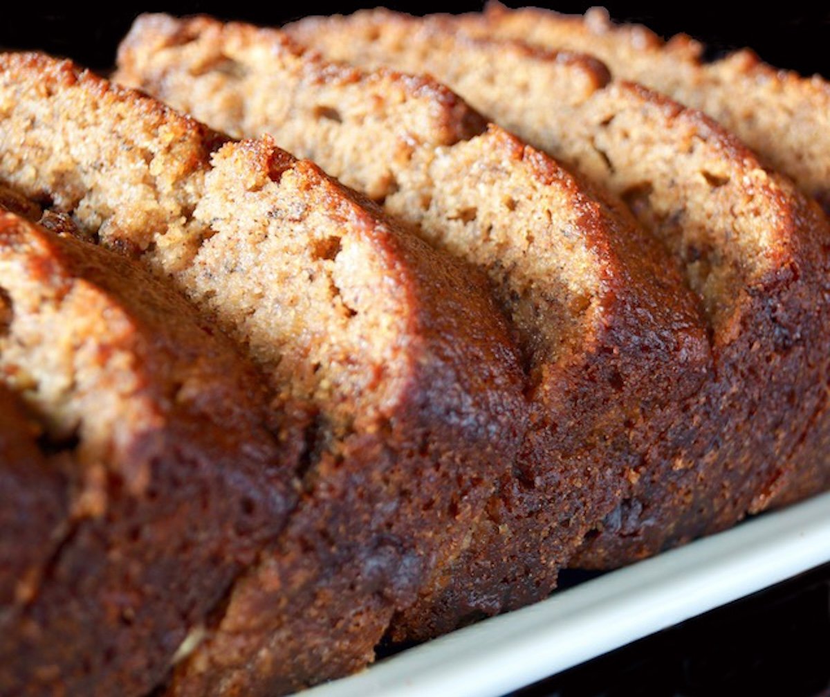 Sliced banana cake on a white plate.