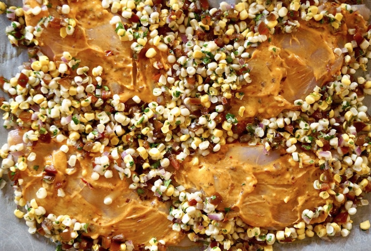 Sheet-Pan-Chipotle-Chicken-with-Corn-Salsa Sheet Pan chipotle chicken with corn salsa before it's baked.