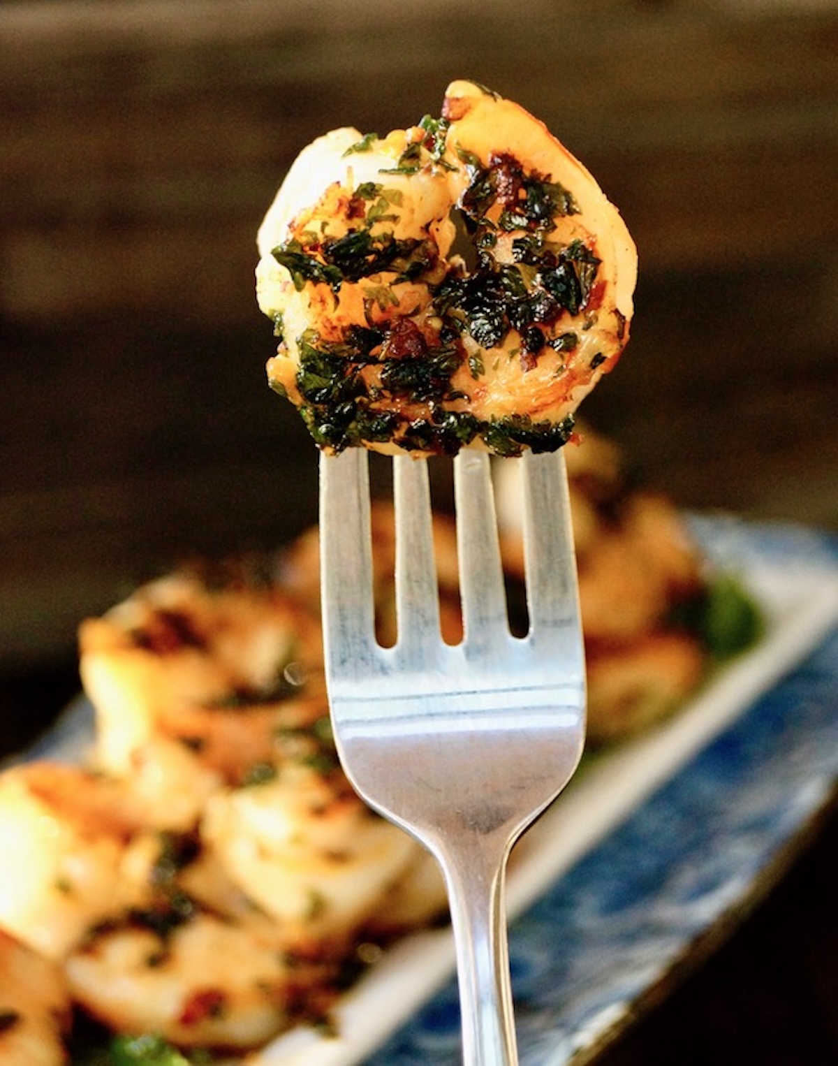 One Spicy Cilantro Shrimp on a fork.