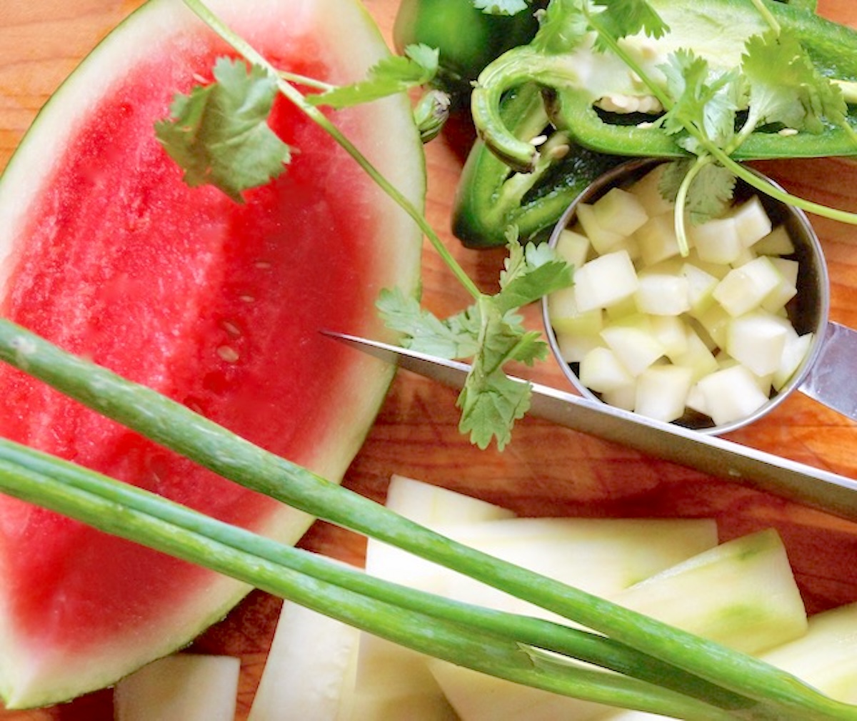 Ingredients for Watermelon Cucumber Salsa including watermelon, scallions, cucumber and jalapeno peppers.
