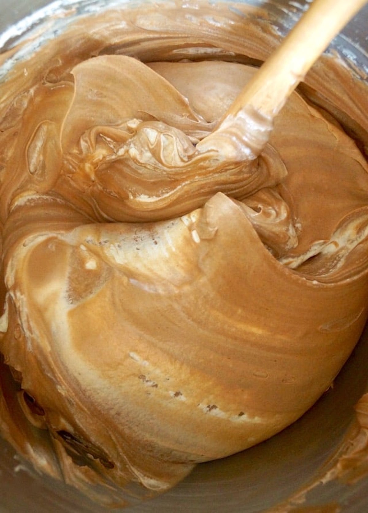 Chocolate-Espresso cream cheese cheesecake filling being mixed with whipped cream.