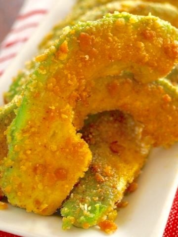 A few Spiced Avocado Fries on a white plate.