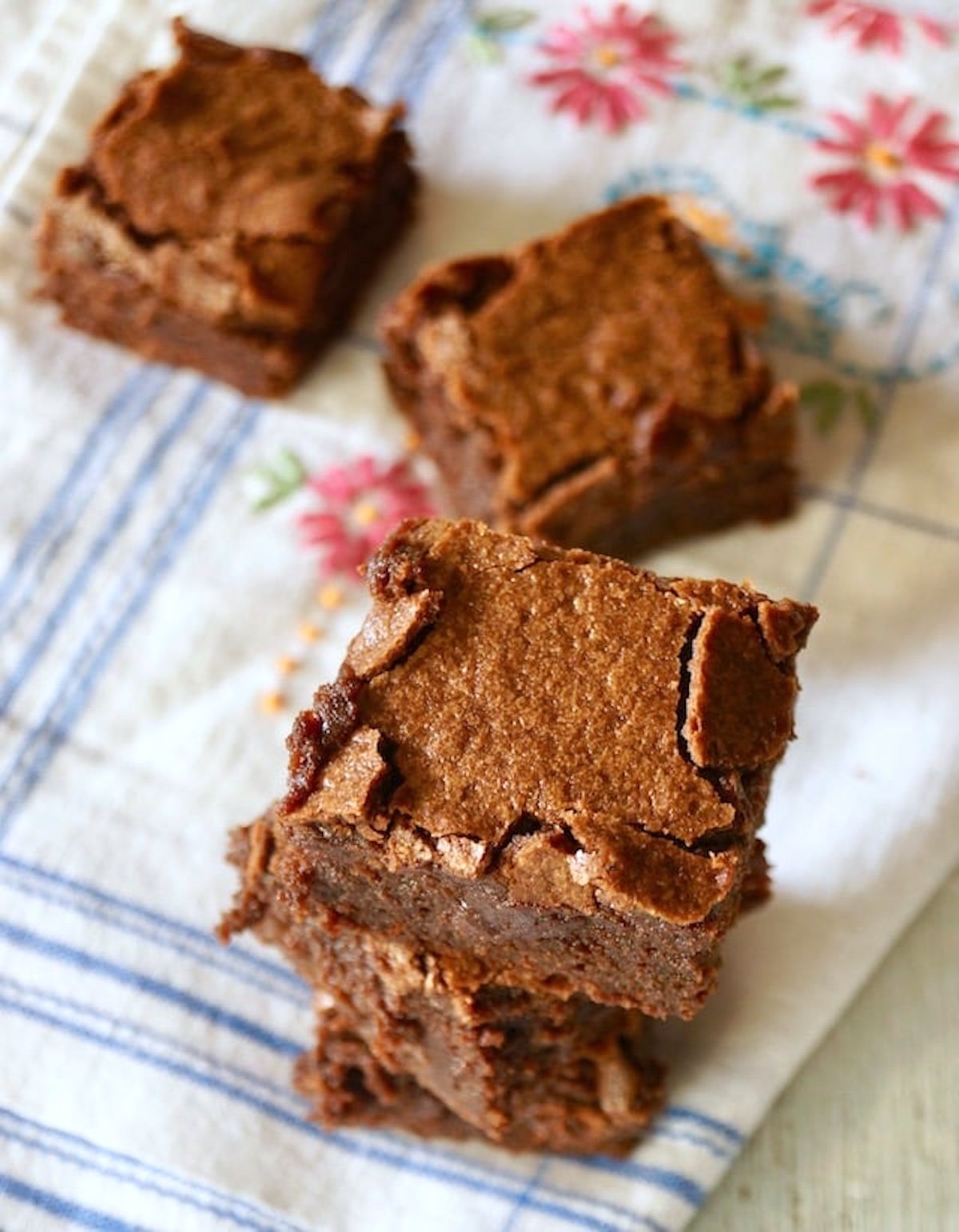 A few Palm Beach Brownies on a white cloth with pink flowers