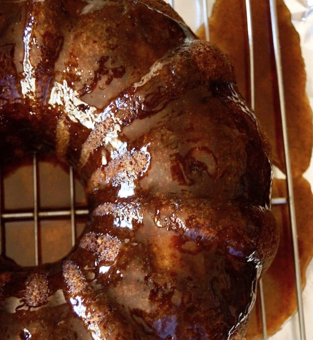 Top view of baked and glazed chai bundt cake on a cooling rack.