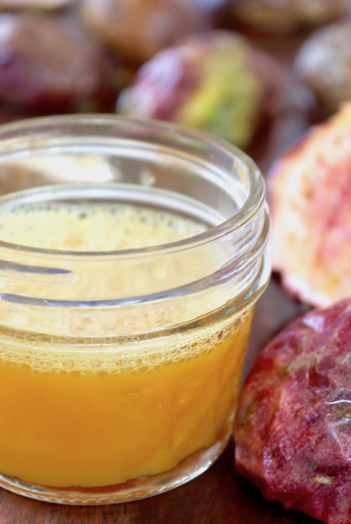 passion fruit juice in a jar with empty passion fruit skins