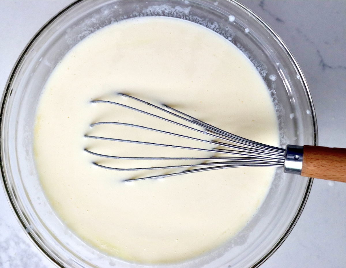Smooth mixture of buttermilk, lemon juice and eggs, with a whisk.