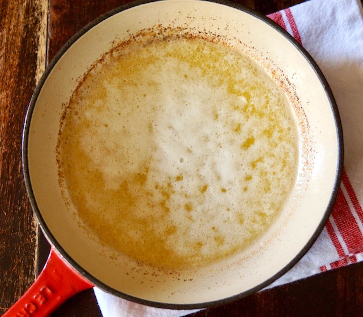 Foamy melted butter in saute pan.