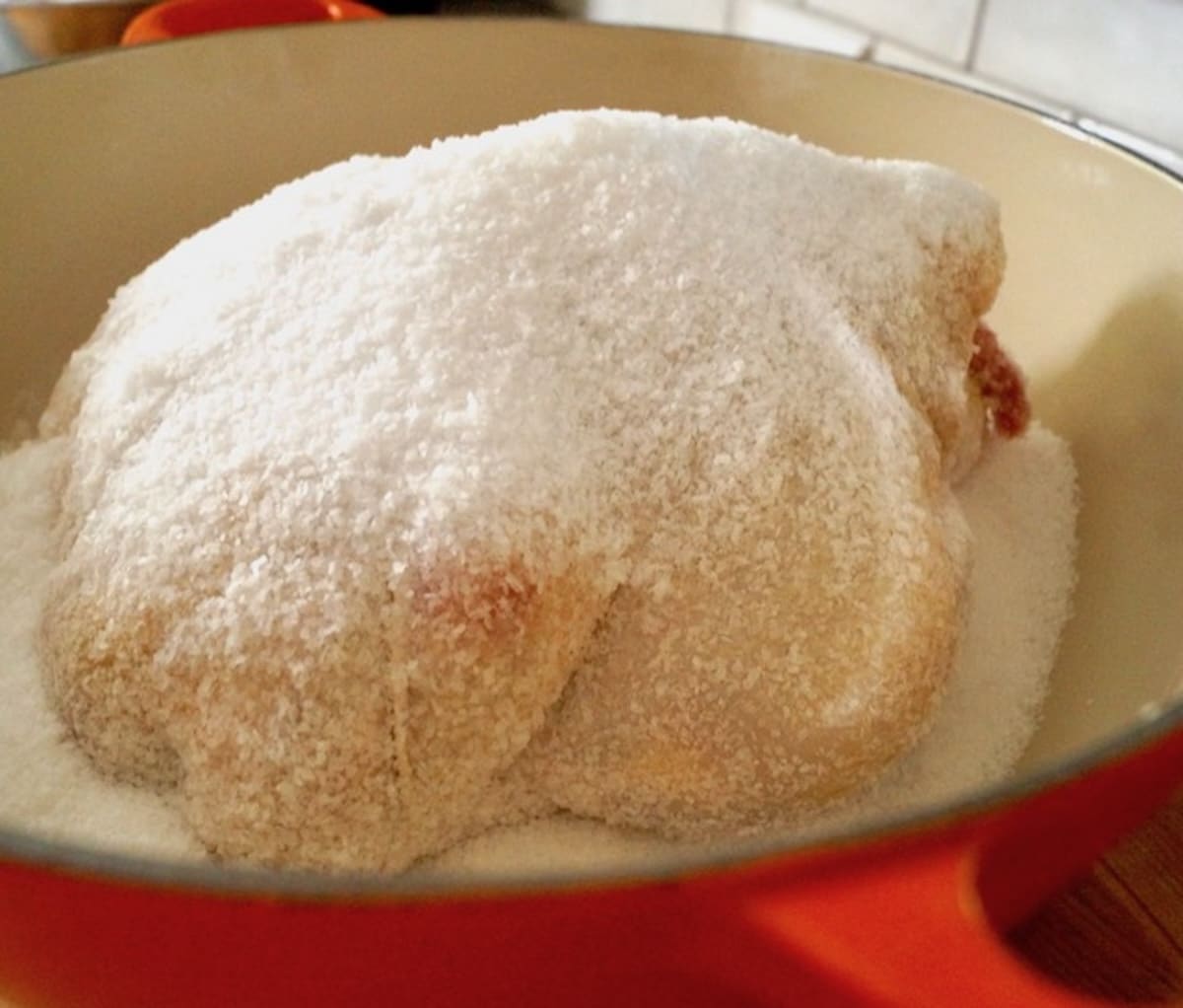 Roasted-Salt-Crusted-Chicken Whole raw chicken covered with salt.