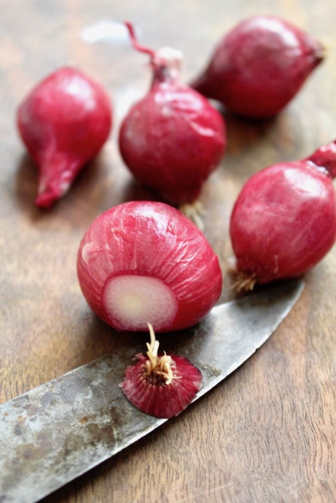 How-to-Peel-Pearl-Onions One pearl onion with root end cut off
