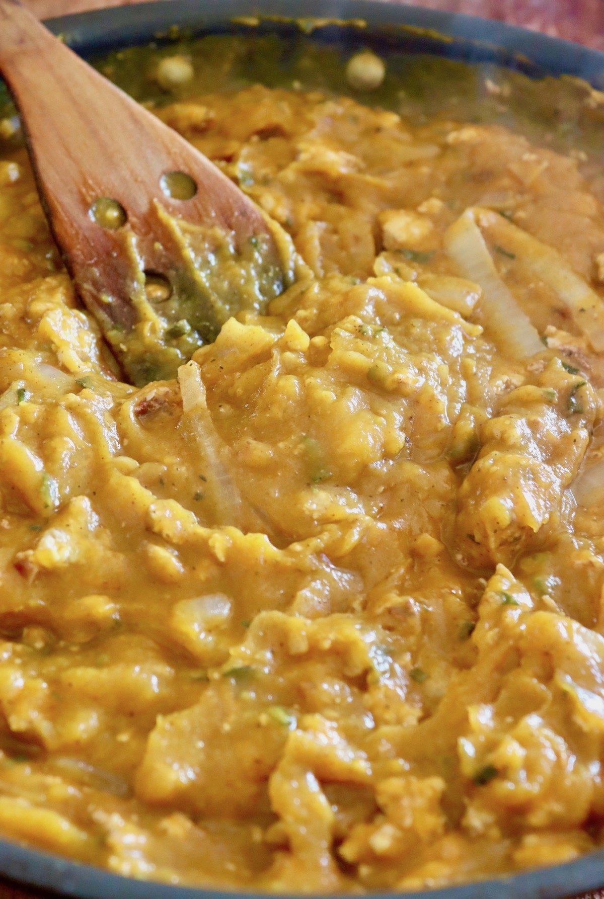 Butternut squash with ground chicken and onions iin a saute pan.