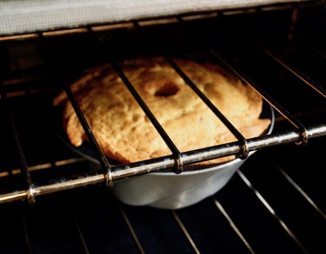 cranberry orange cake in oven on rack