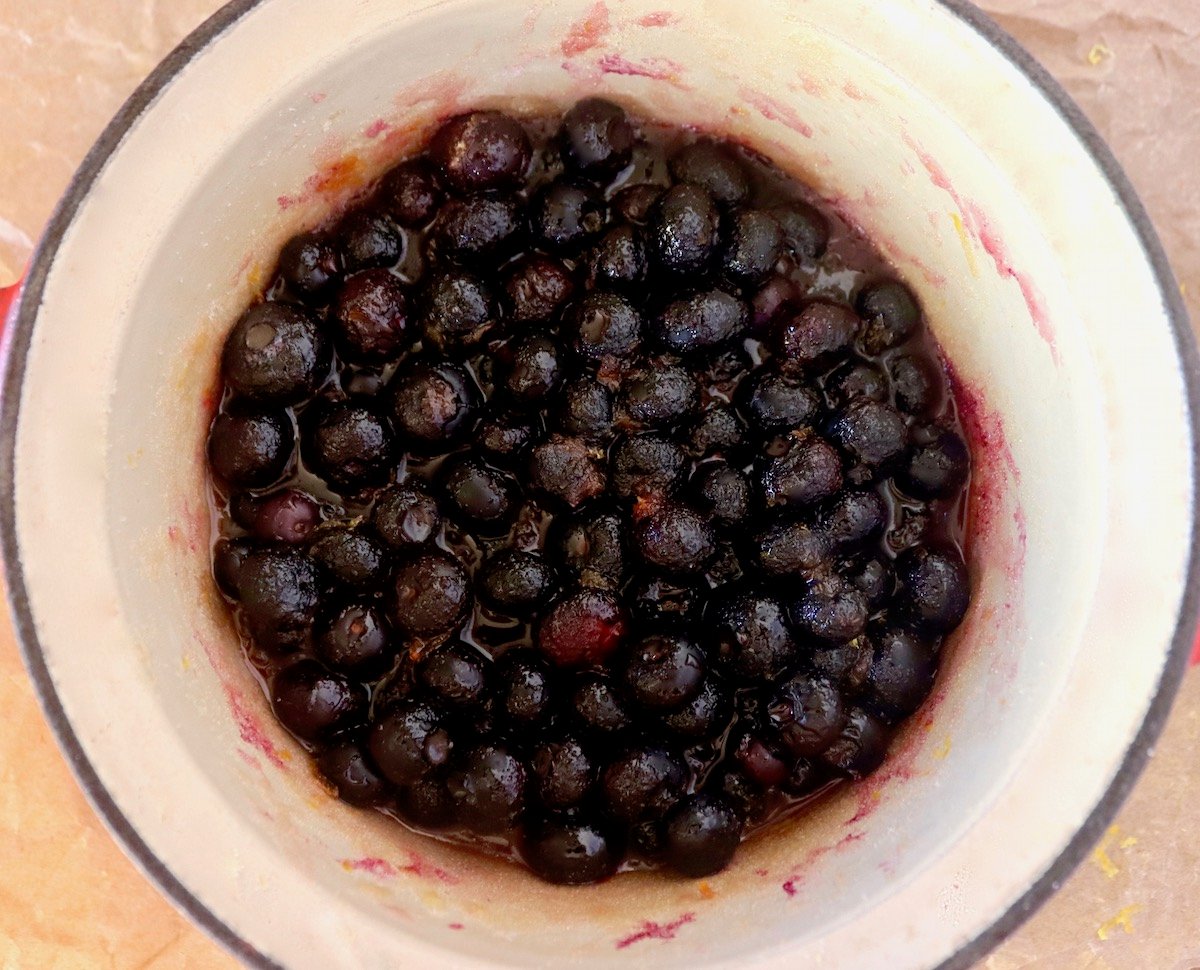 Small pot with cooked blueberries.