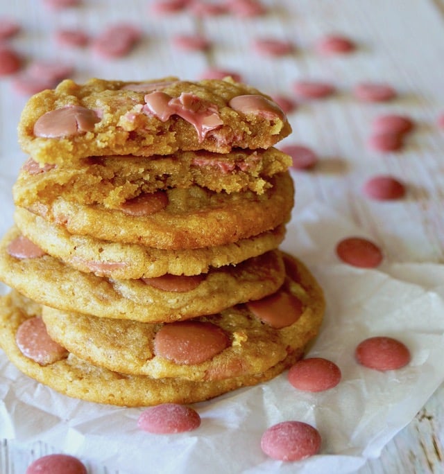 pile of ruby chocolate chip cookies with one broken one on tip