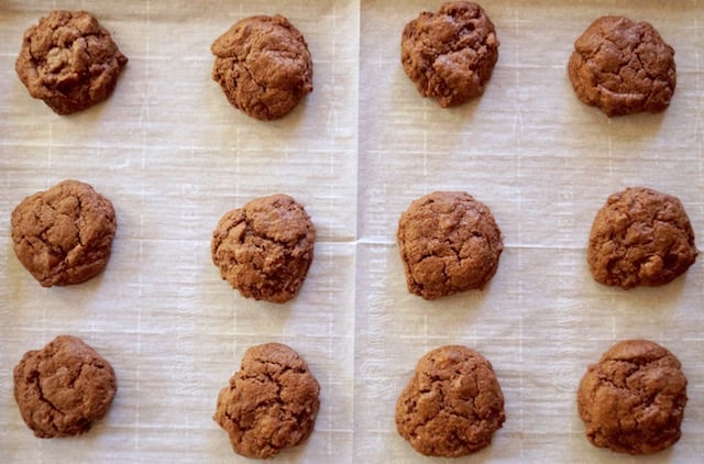 top view of baked chocolate avocado cookies on parchment paper