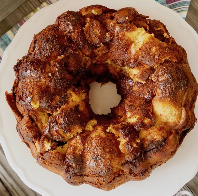 Top view of golden brown bundt-shaped French toast bread pudding cake.
