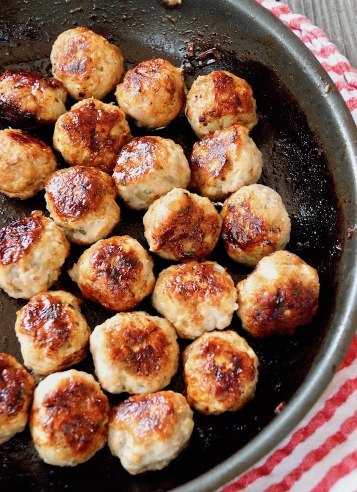 Rosemary-Turkey-Meatballs-with-Honey Saute pan full of turkey meatballs