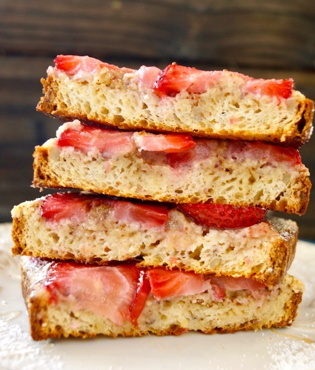 Strawberry-Frangipane-Toast-Recipe Four pieces of Frangipane toast with strawberries in a stack.