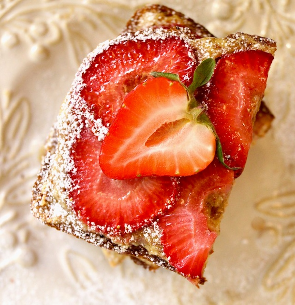 Strawberry-Frangipane-Toast-Recipe Top view of Strawberry Frangipane Toast on white plate.