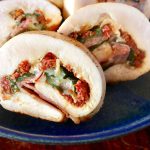 Sliced chicken roulade filled with sun-dried tomato, basil and cheese.