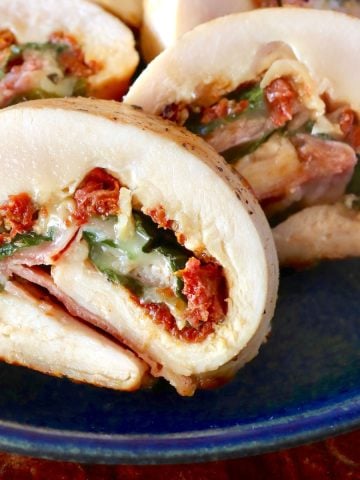 Sliced chicken roulade filled with sun-dried tomato, basil and cheese.