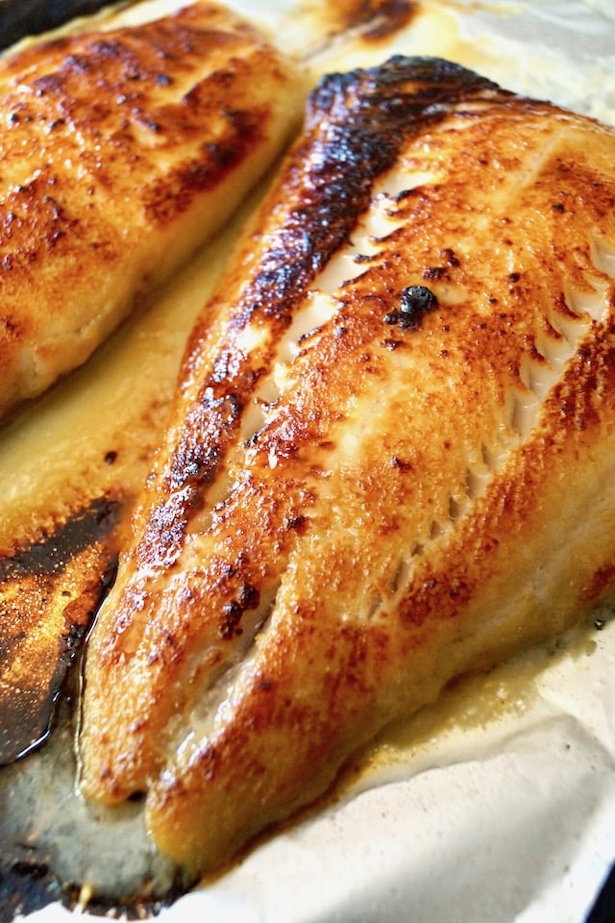 Large miso broiled fillet on a foil-lined baking sheet.