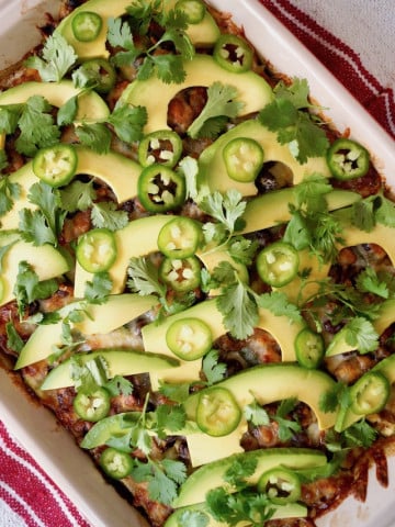 Southwestern Casserole with Mushrooms with sliced avocado on top.