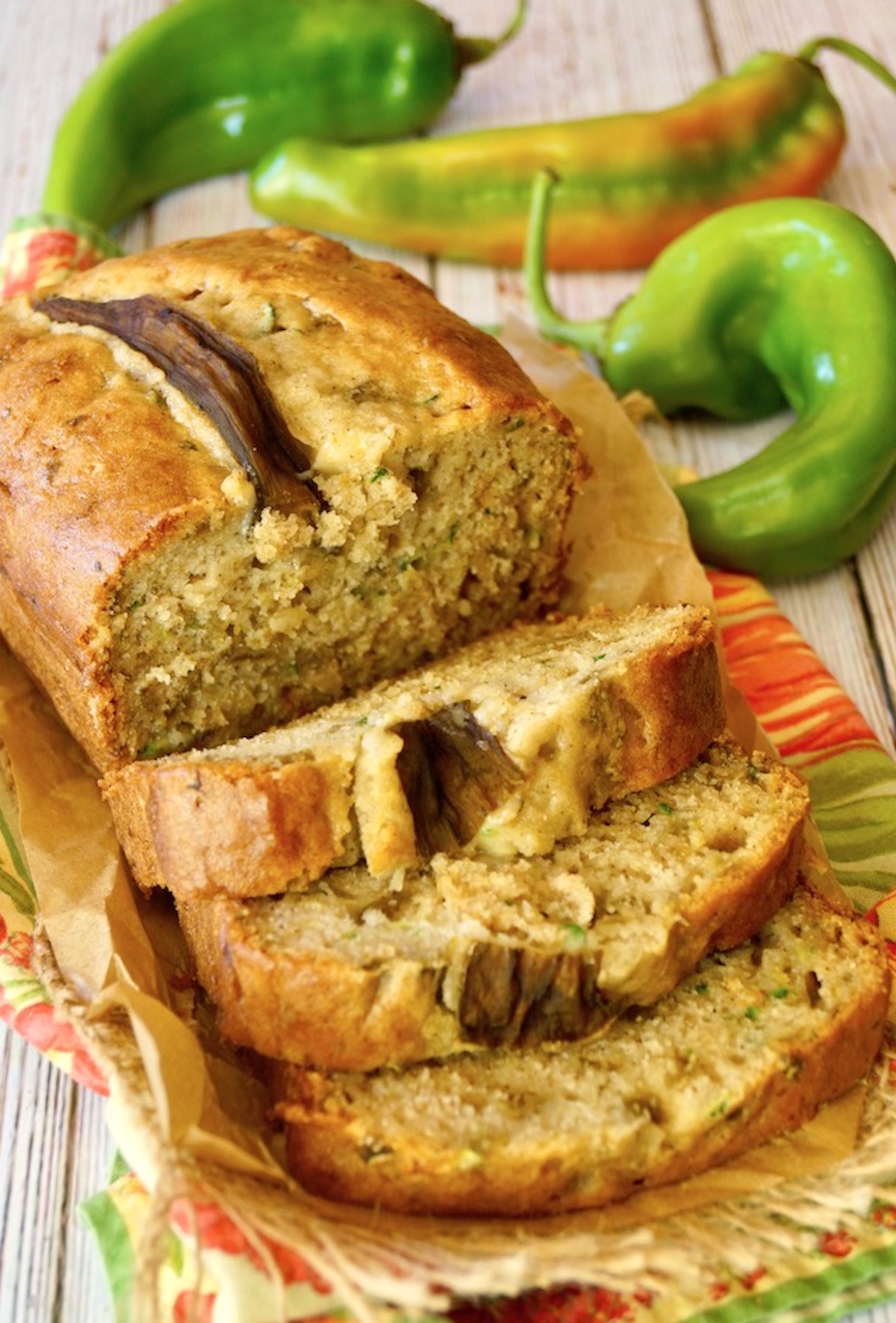 Gluten-Free-Zucchini-Bread half sliced Hatch Chile Zucchini Bread on red and green cloth