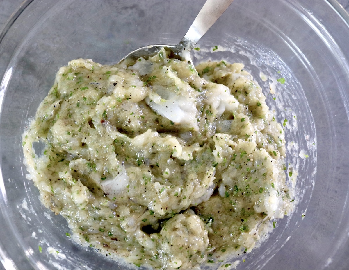Paste-like mixture of shrimp and cilantro with chunks of shrimp.