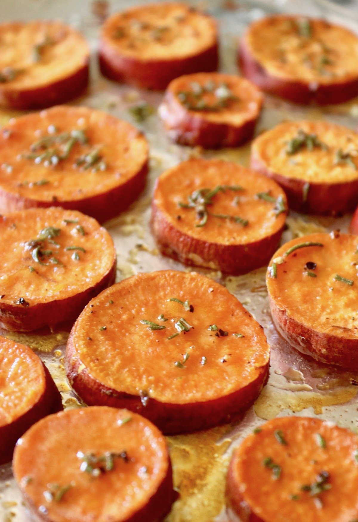 Baked sweet potato slices on foil. 