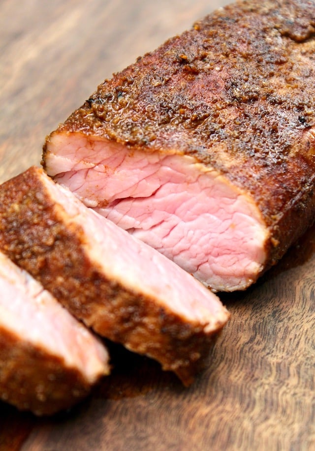 Cross section of sous vide pork tenderloin on cuting board