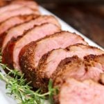 sous vide pork tenderloin with coffee rub on white platter