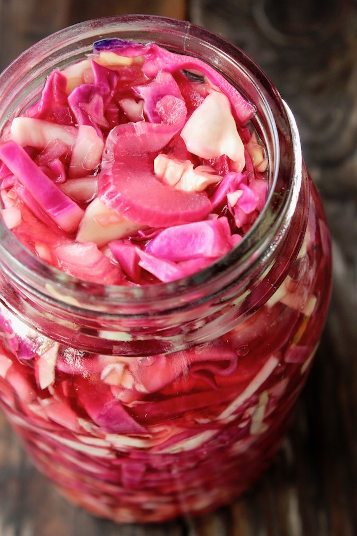 Close up, top view of pickled cabbage in a Mason jar.