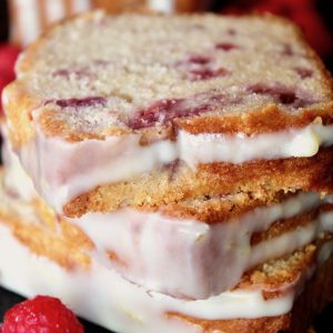 three slices of White Chocolate and Raspberry Loaf Cake stacked