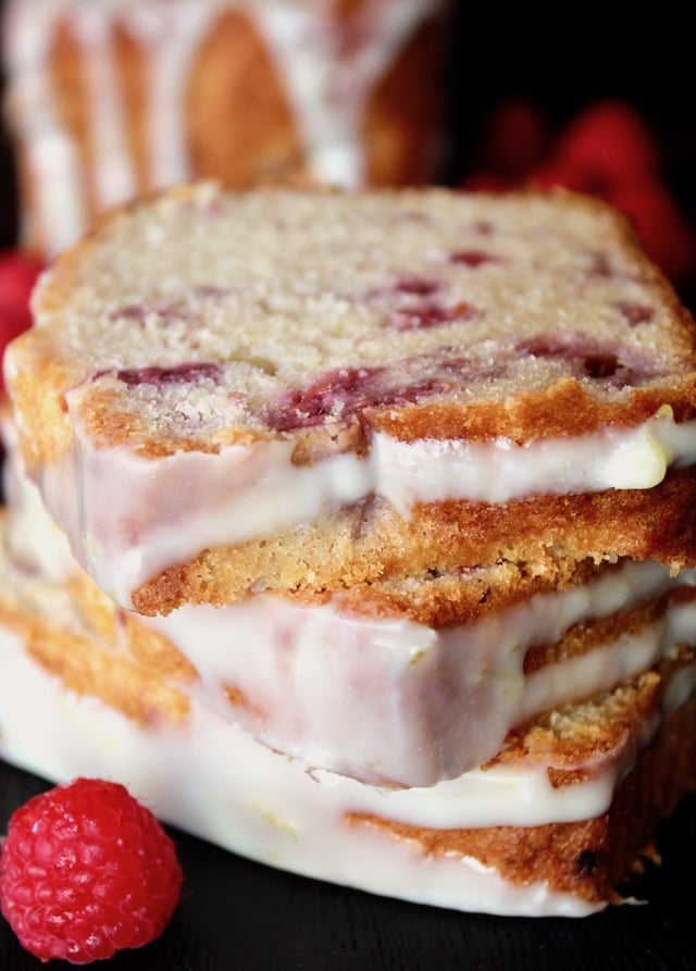 three slices of White Chocolate and Raspberry Loaf Cake stacked