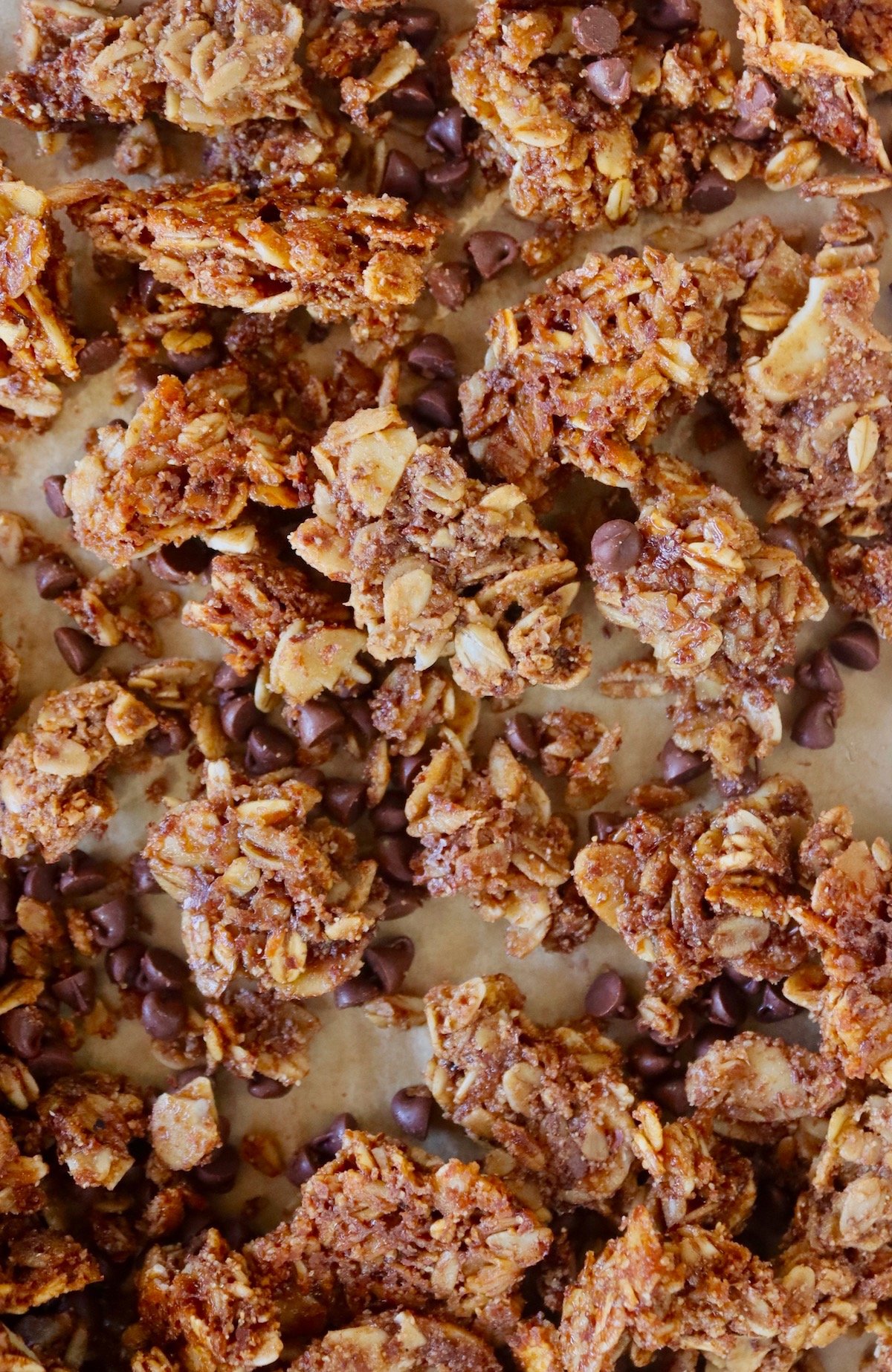 Coffee Chocolate granola bronken into big chunks on sheet pan.