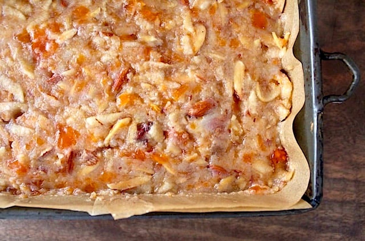 Persimmon cake batter in a loaf pan, smoothed on top.