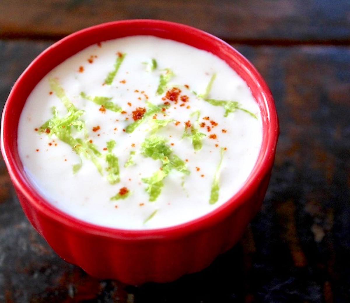 Red bowl with yogurt lime dip.