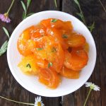 top view of super chunky marmalade on a small white plate.