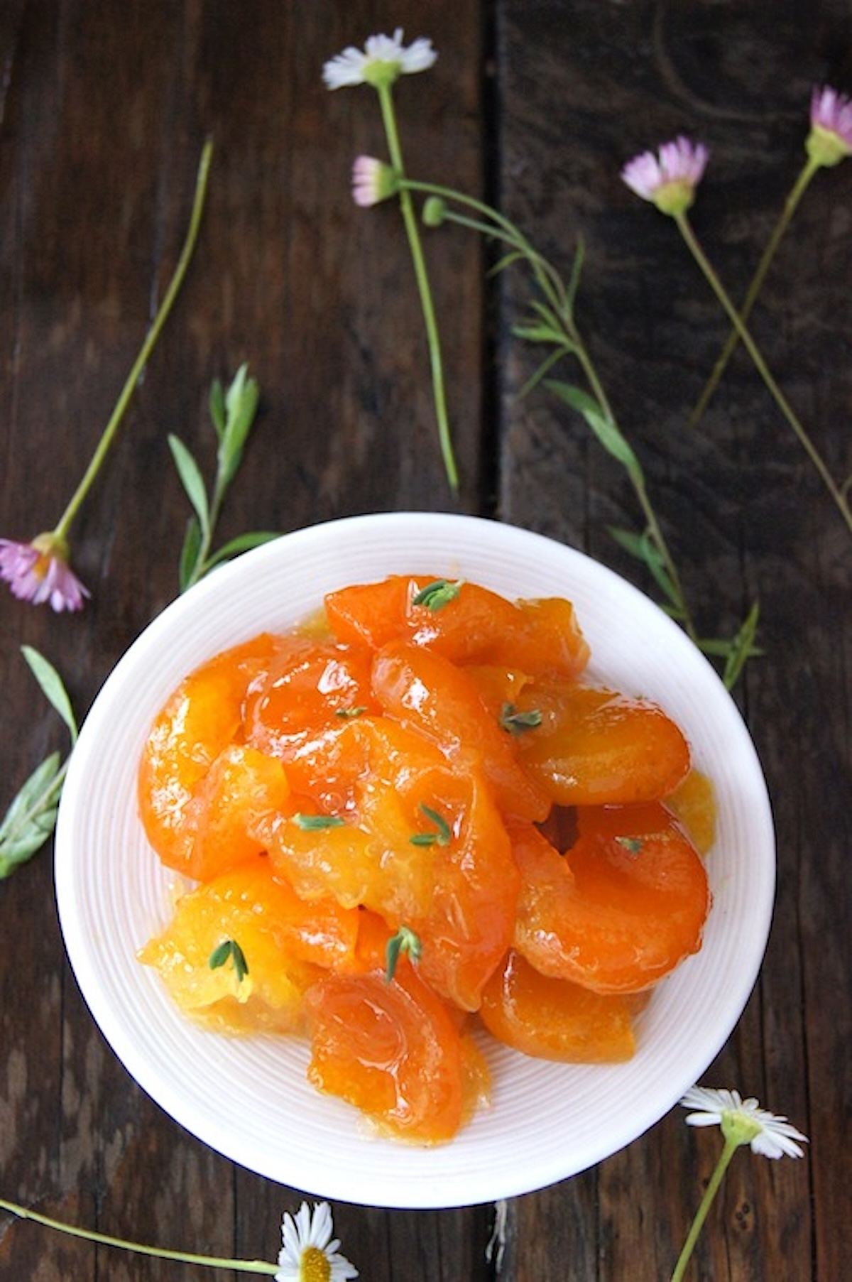 Kumquat-Marmalade-with-Ginger Small white dish with kumquat marmalade.