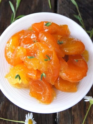 top view of super chunky marmalade on a small white plate.