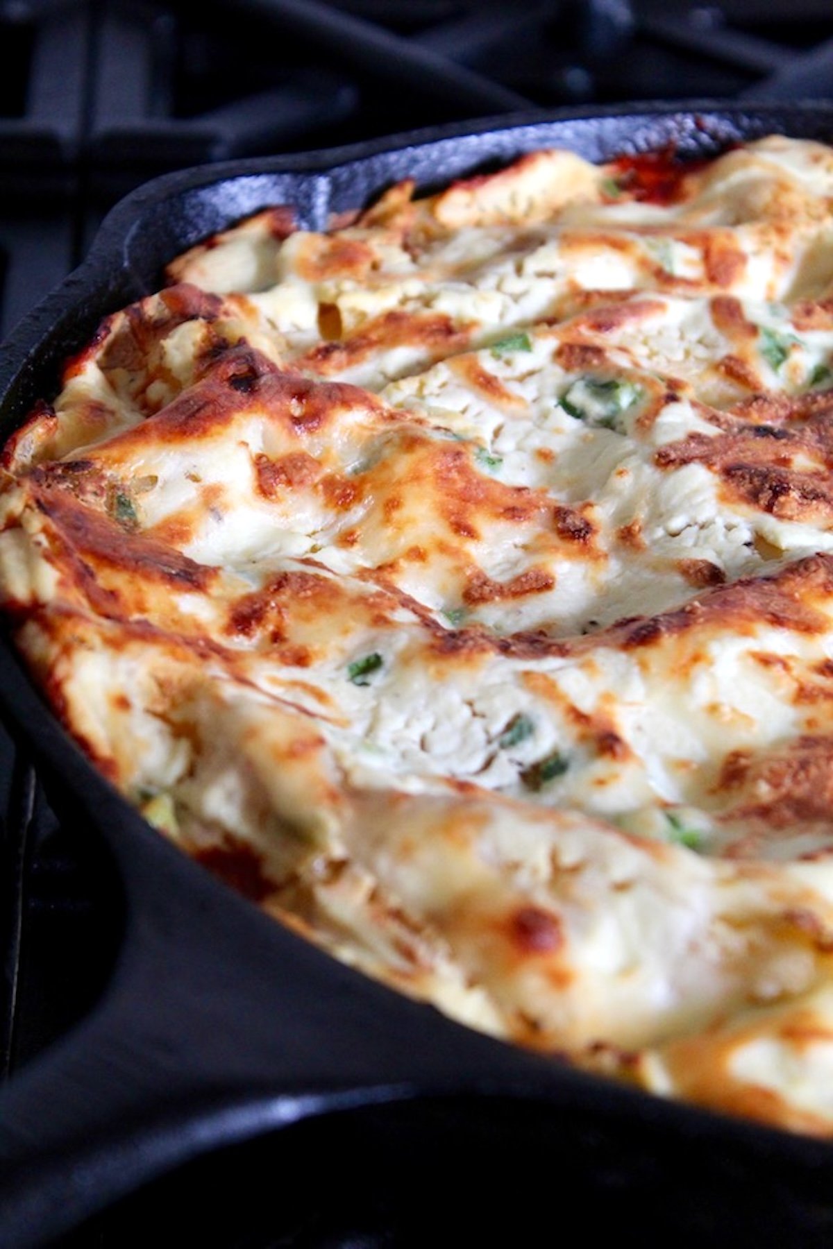 Root-Vegetable-Lasagna-with-Carrots Baked lasagna in a cast iron skillet.