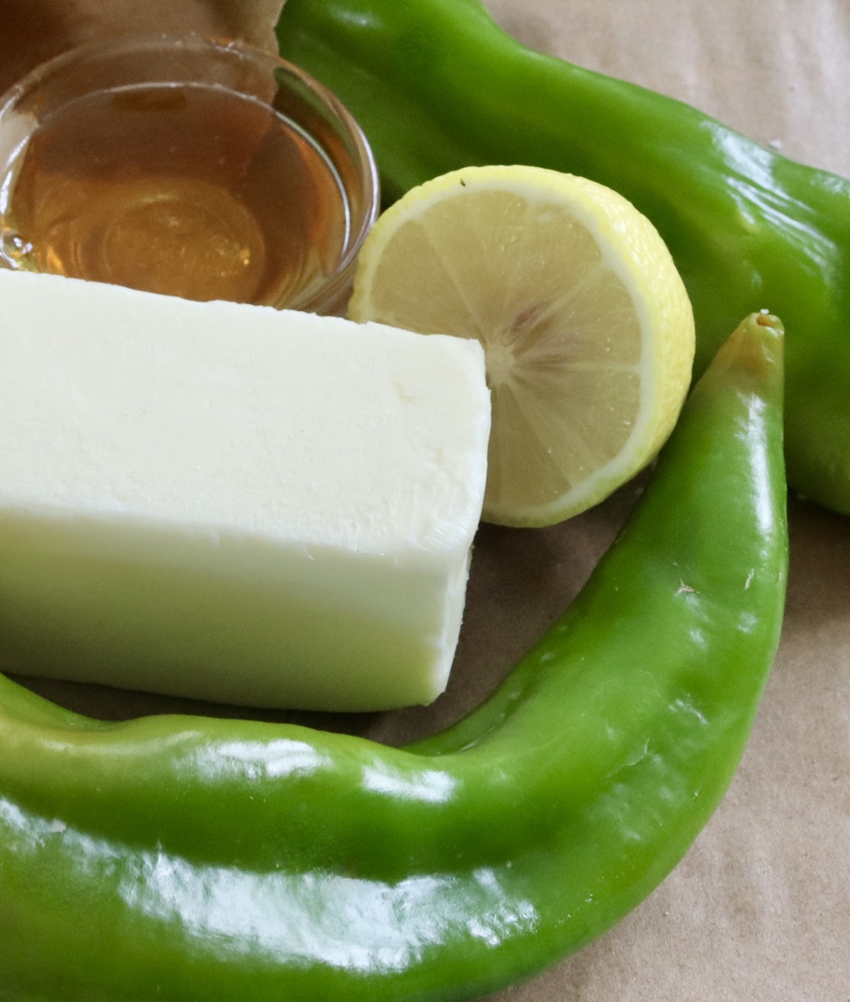 Stick of butter, hatch chiles, half a lemon and a tiny bowl of honey.